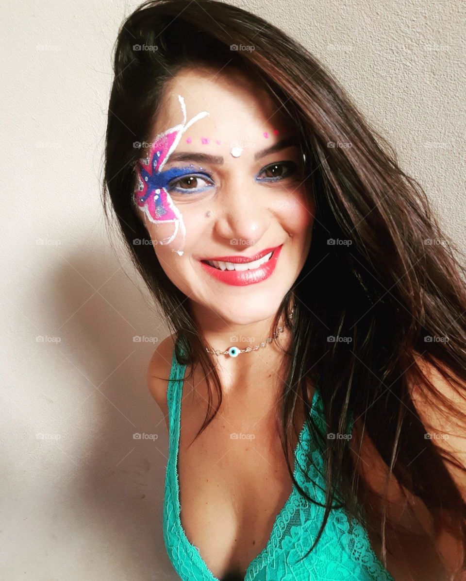 woman with butterfly painting on face