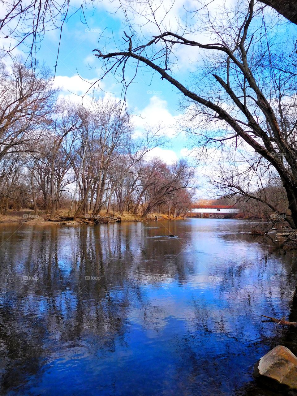 Covered bridge and white river in Indiana. 