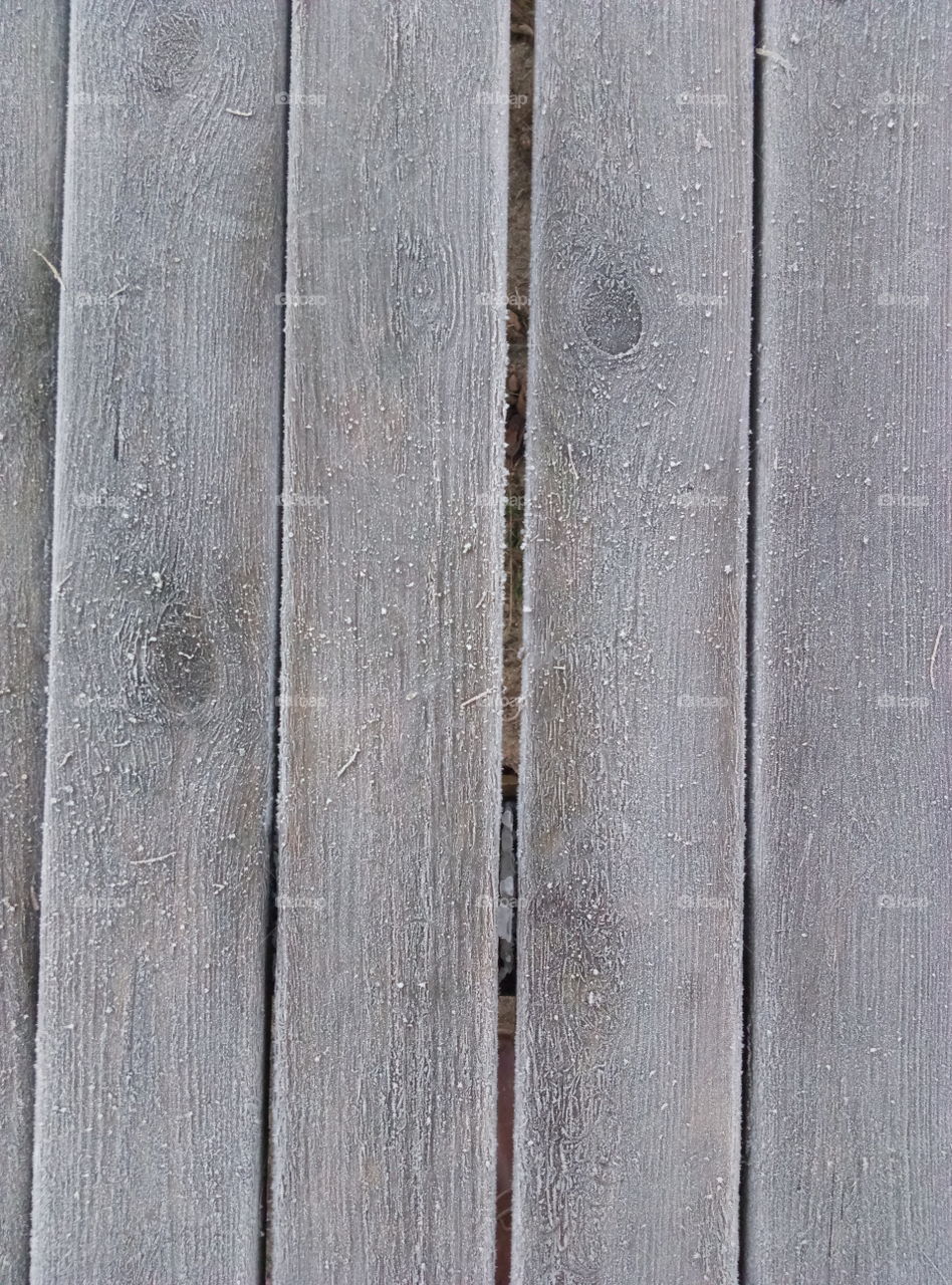 grey wooden frozen table in the garden