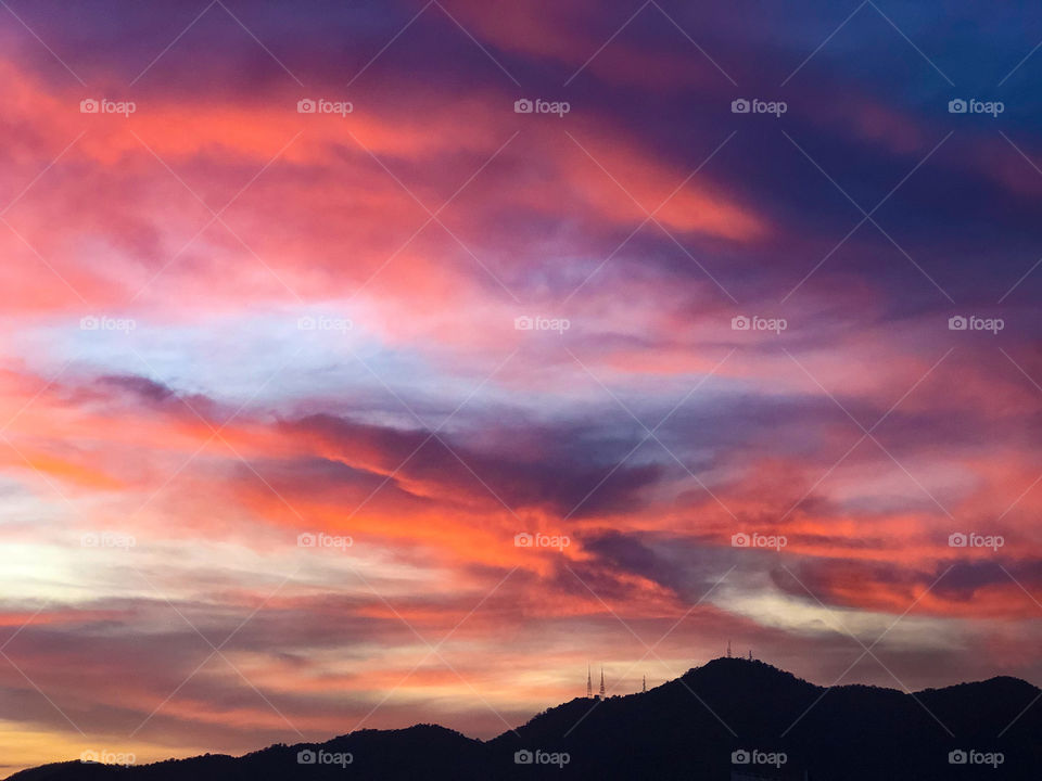 Orange Purple clouds during sunset 