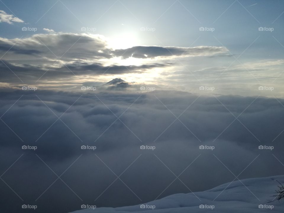 Mountain Cusna in the clouds at sunset