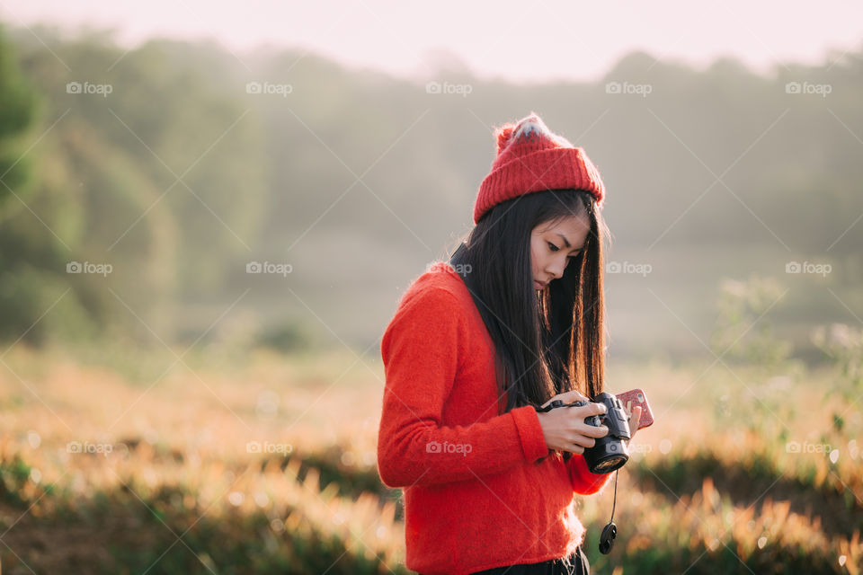 Chinese tourist girl looking at the camera 