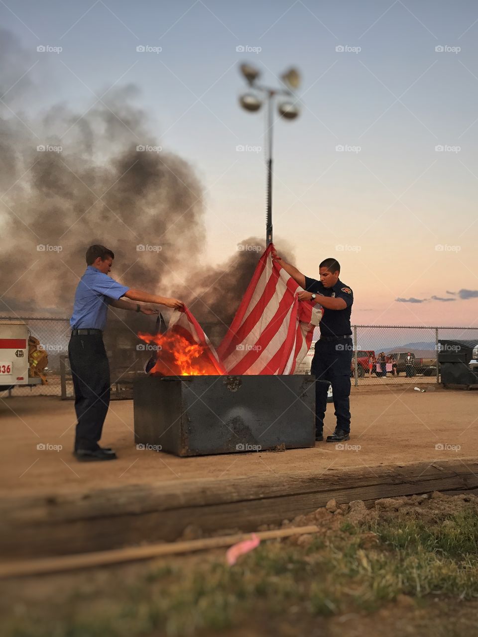 Retiring the flag. On the Fourth of July the fire department was retiring old worn-out flags in the way they're supposed be retired. 