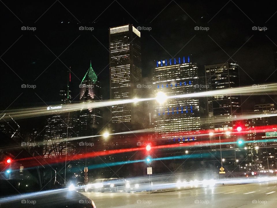 These picture was taken while I was in a car to home at night in Chicago. Night light in the city. 