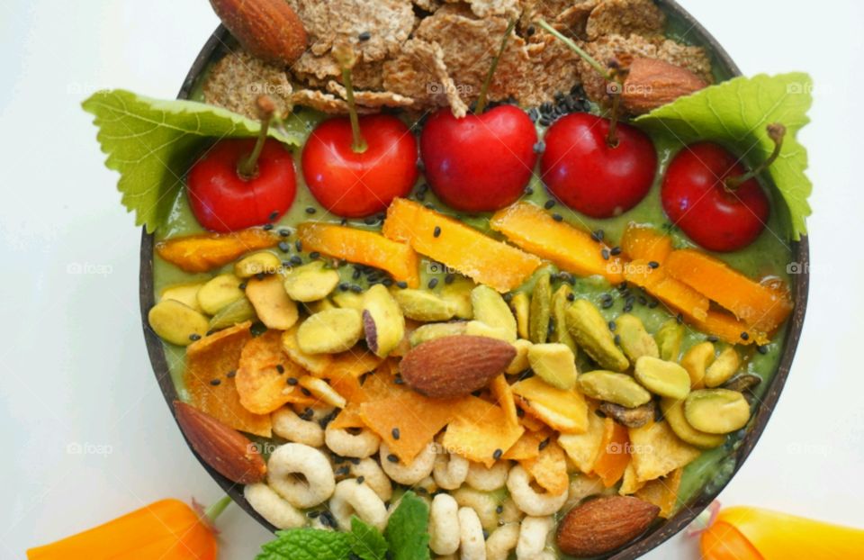 Fresh Fruit Smoothie Bowl - cheery, mango, banana, cereals,  seeds and nuts