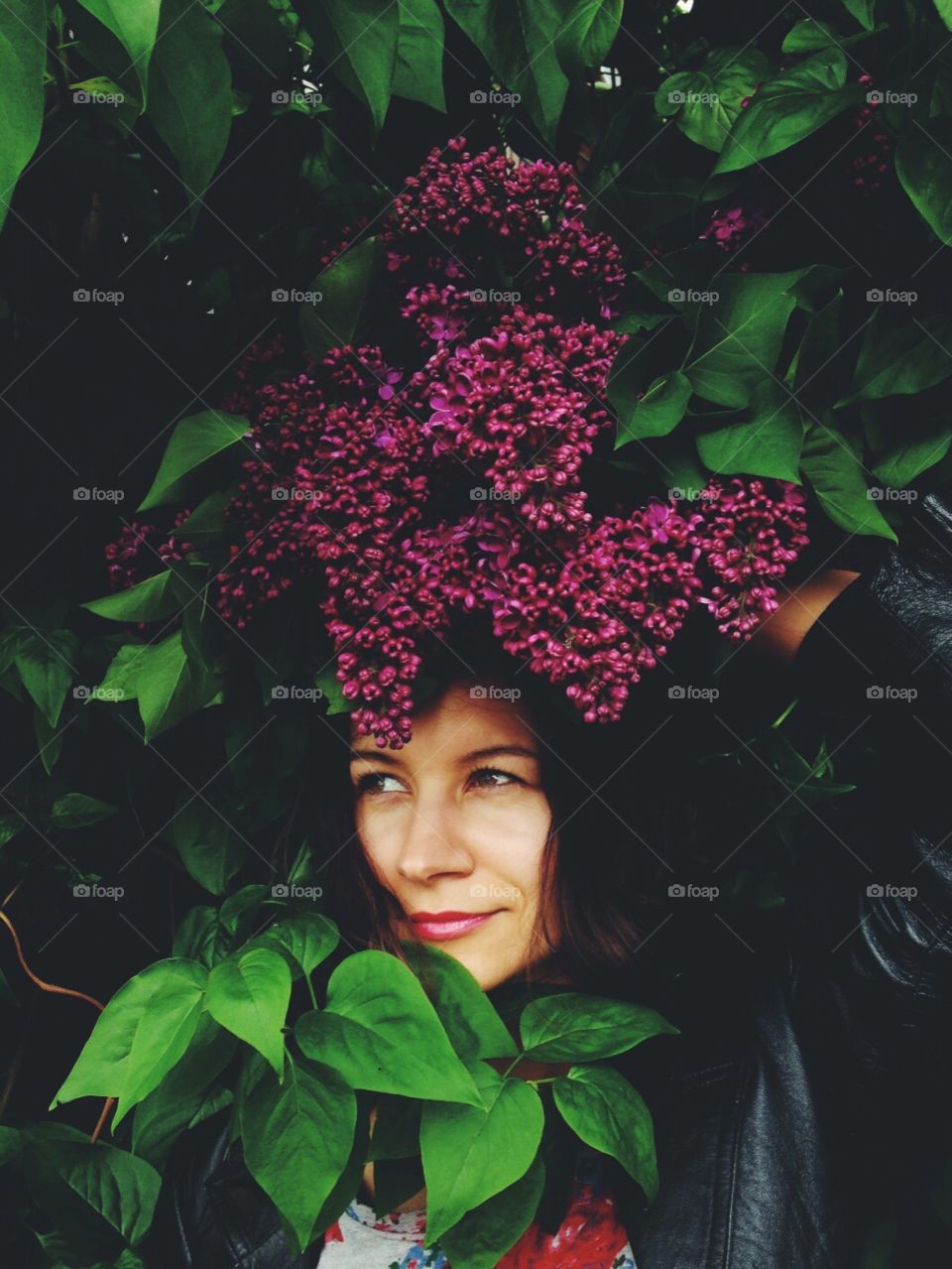 Blossoming tree with a girl hiding in it.