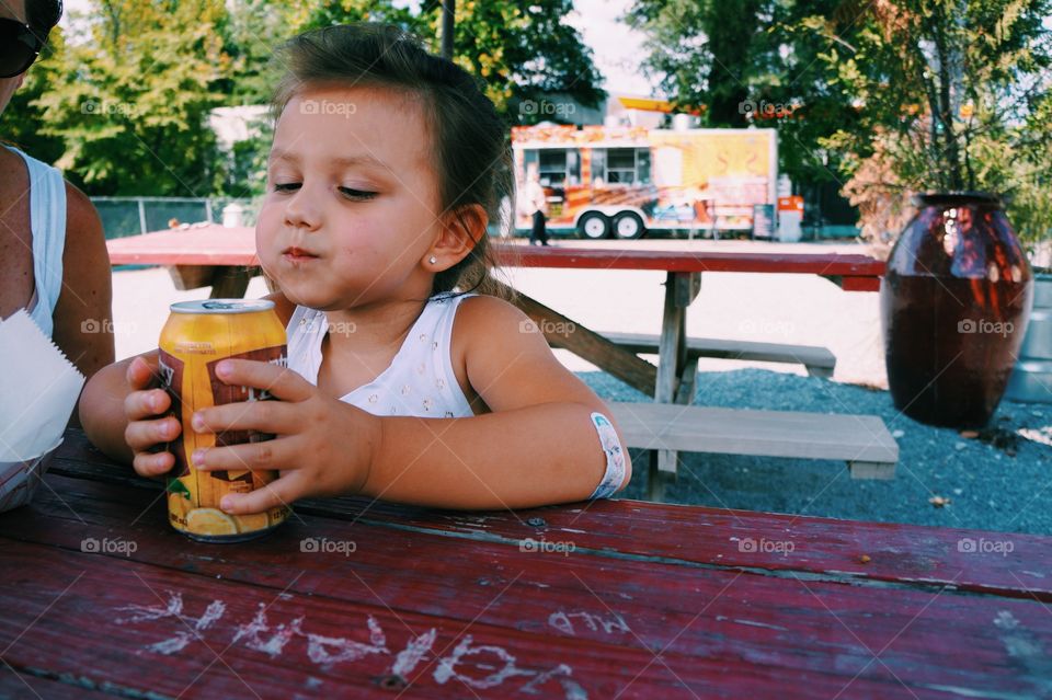 Girl holding drink carton