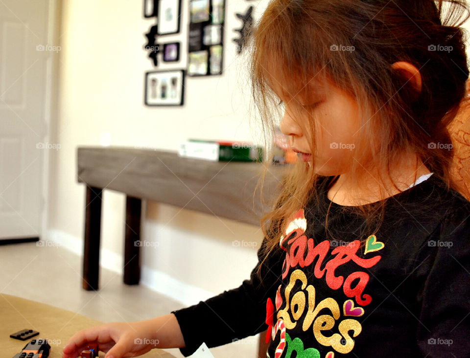 Girl playing Legos