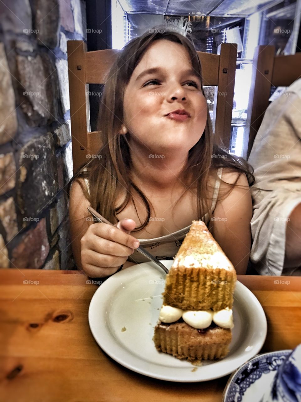 Small girl eating cake