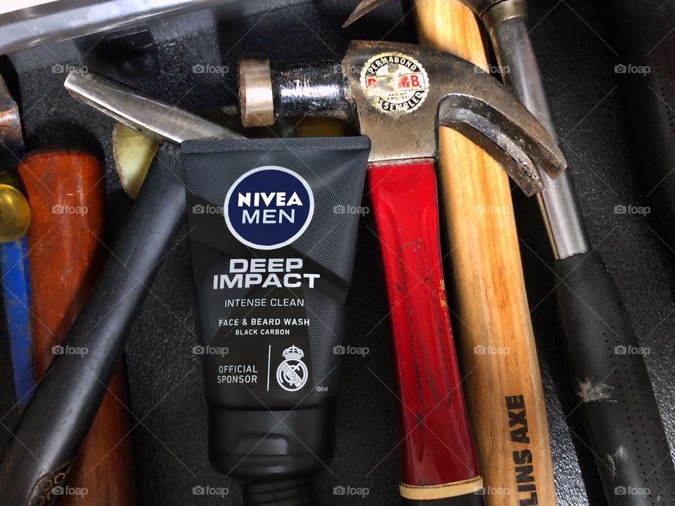 Mans beard wash in the tool drawer.