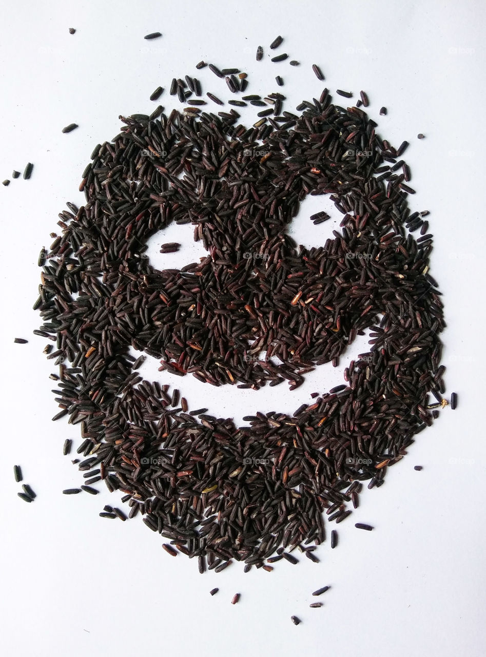 Thai rice , smile with white background.