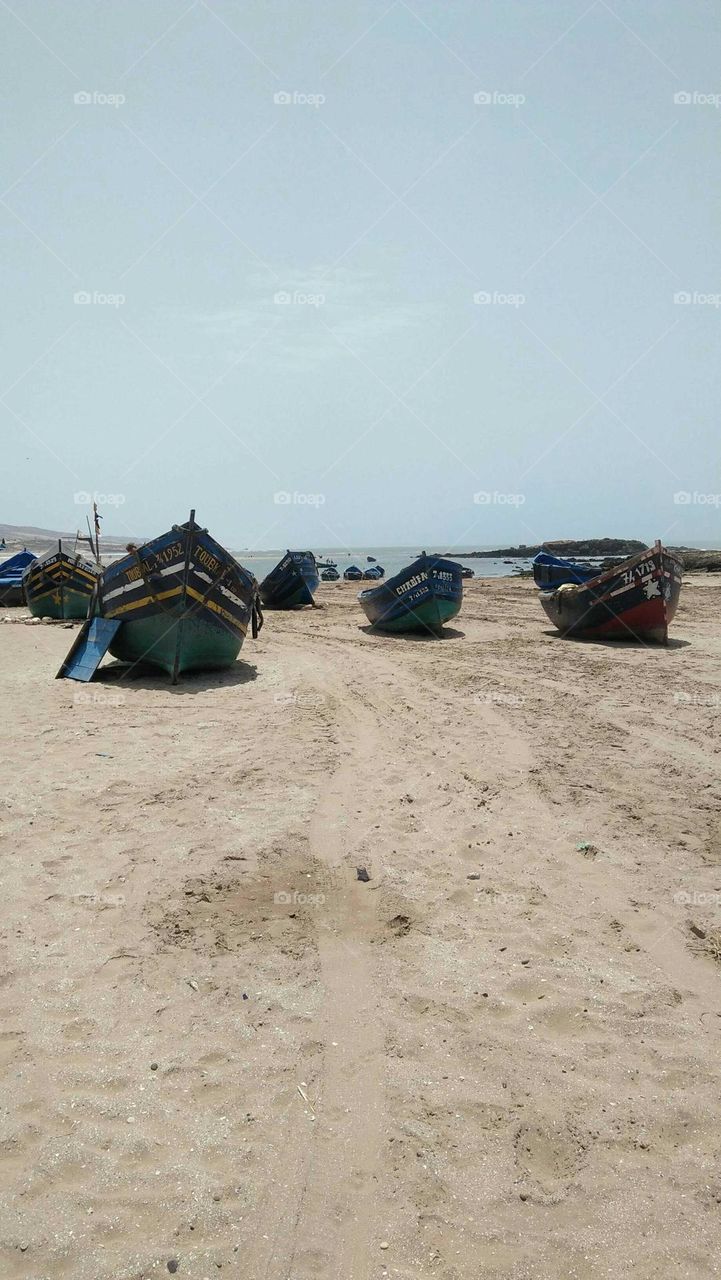 Beautiful boats on sand