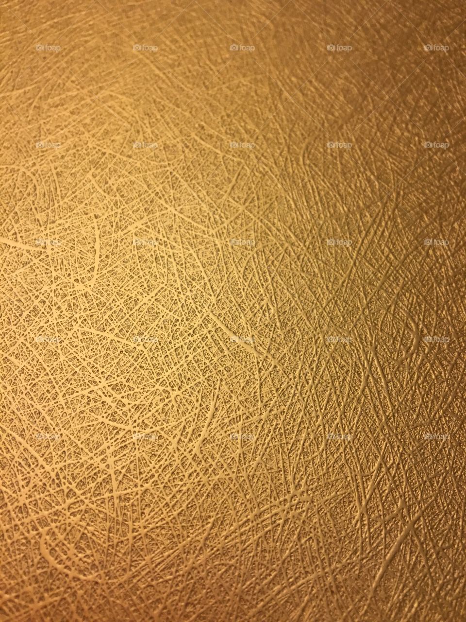 Textured gold scrapbook paper. 