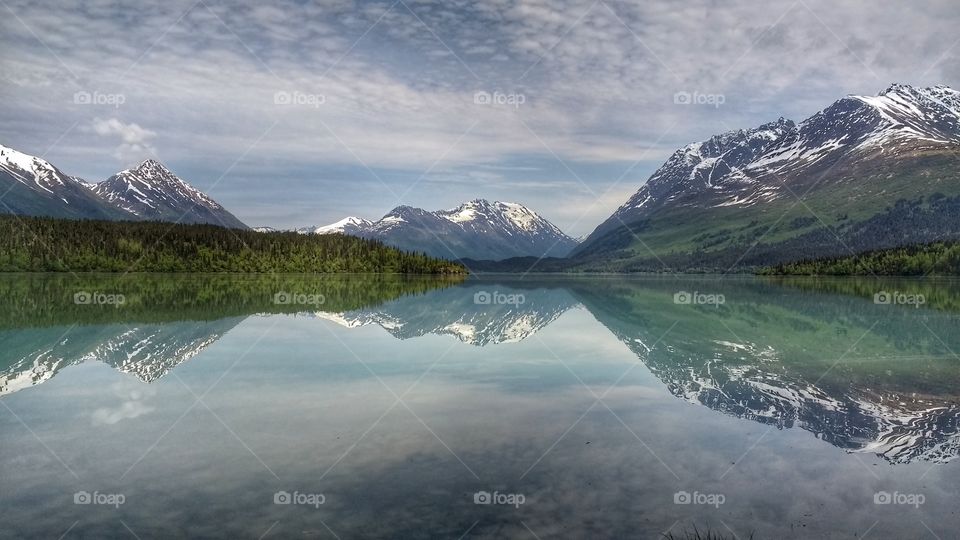 Mountains reflected on  calm secluded lake