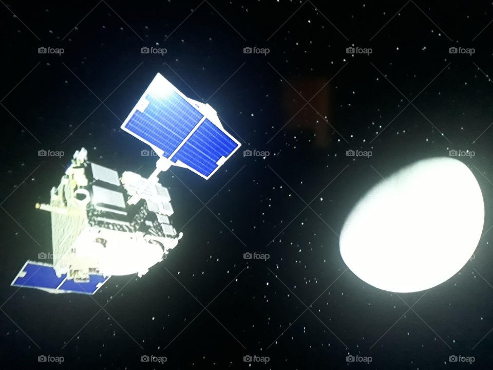 a beautiful picture of a satellite transmitting its photos from the Universe to Earth