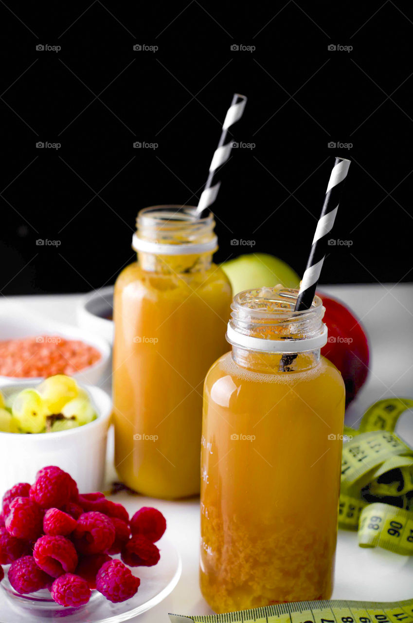 Delicious fruits smoothie served with fresh fruits