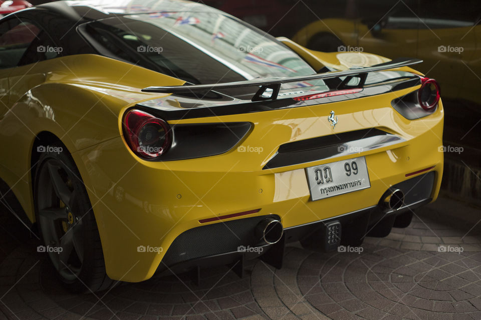 rear view of Ferrari 488 spider blue coupe sports car, 3.9 liter V8 twin turbocharged produced by the Italian sports car - Ferrari F154CB V8