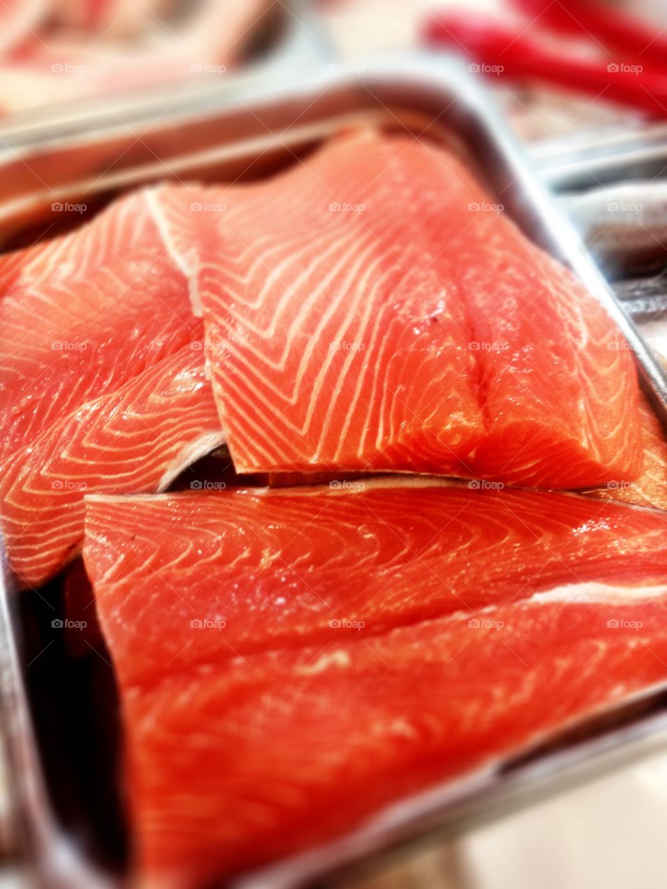 Fresh Salmon steaks at fish market. Detail photo of fresh salmon steaks at a local fish market