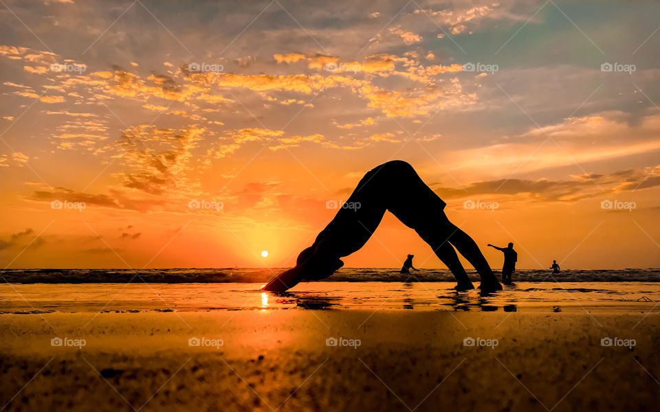 People at the beach, having fun with themselves during sunset time, a bright day for welcoming night that day
