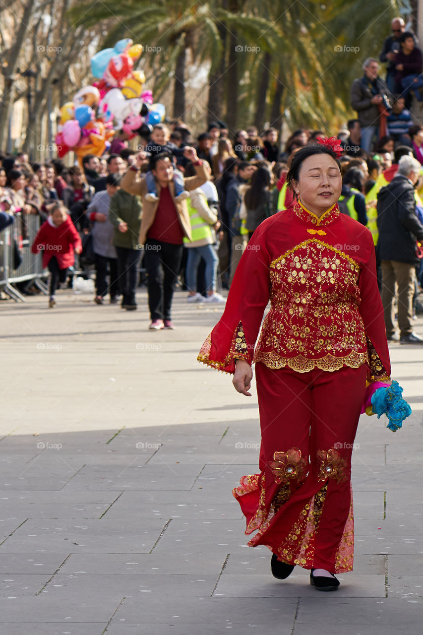 Chinese New Year. Alone in front of the crowd 