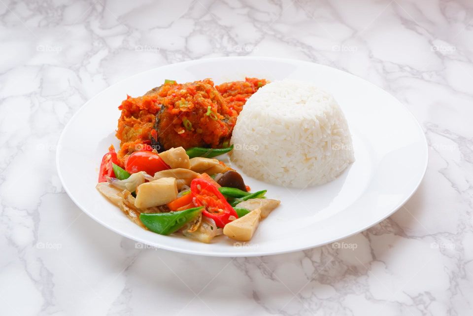 White rice with fish and vegetables, Malaysian style dish