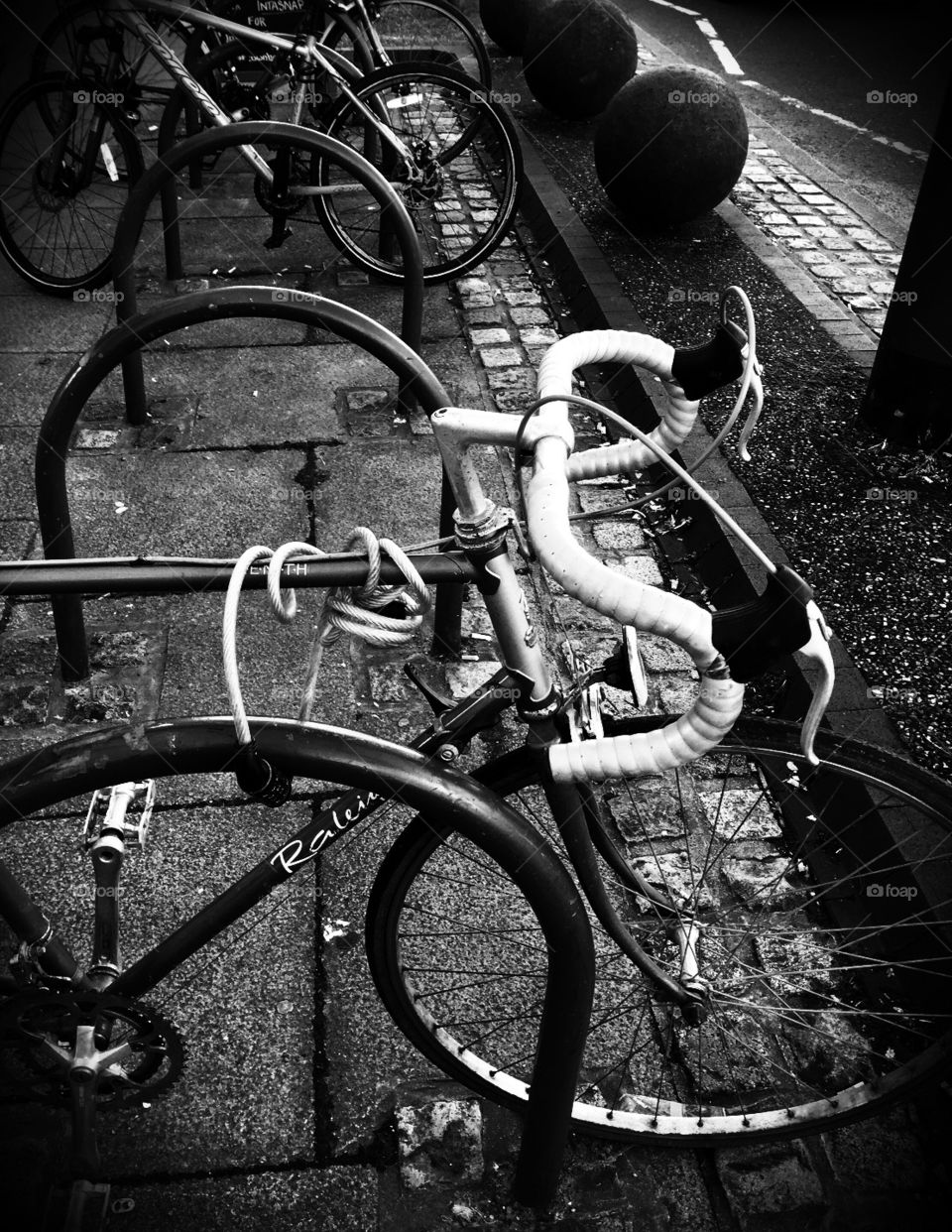 Monochrome Bikes In A Bike Rack On The Streets Of England 