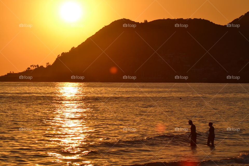 View of beach at sunset