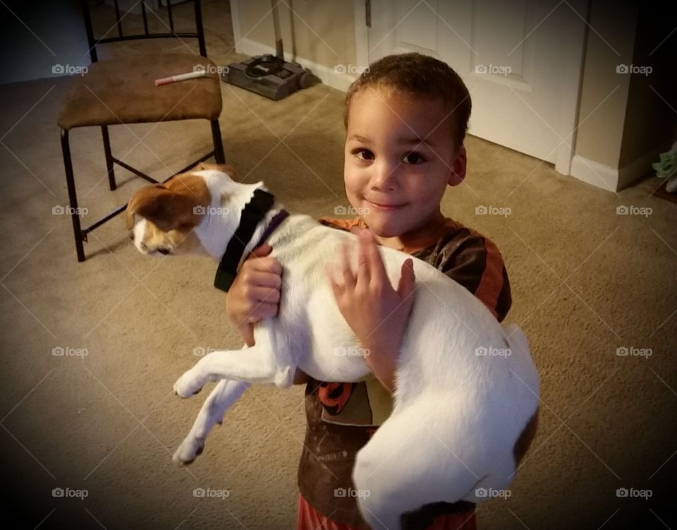 Child Holding Dog