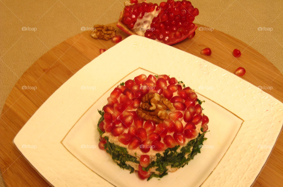 Greenery chicken salad with walnuts and pomegranate