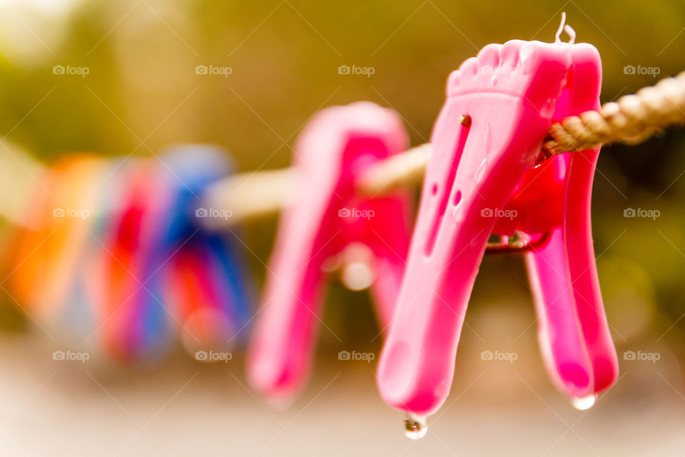 Clothes pegs on rope
