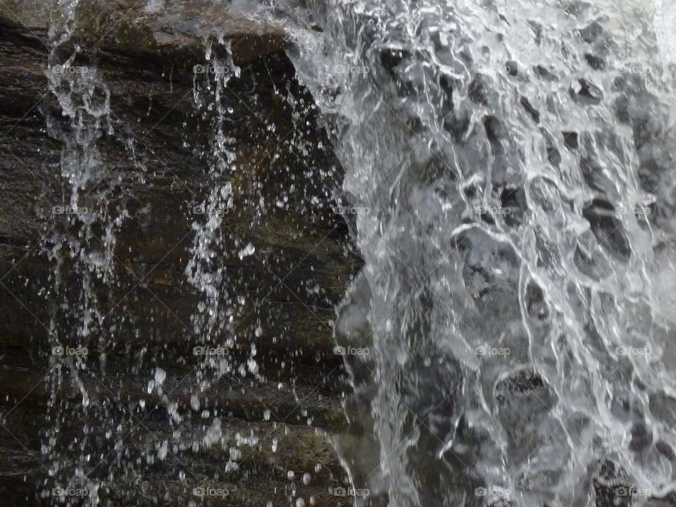waterfall drops and stream