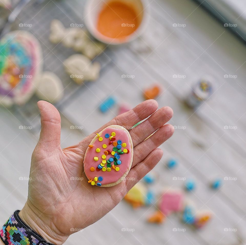 Making brightly colored Easter cookies, color explosion with homemade cookies, baking with kids at home, making sugar cookies