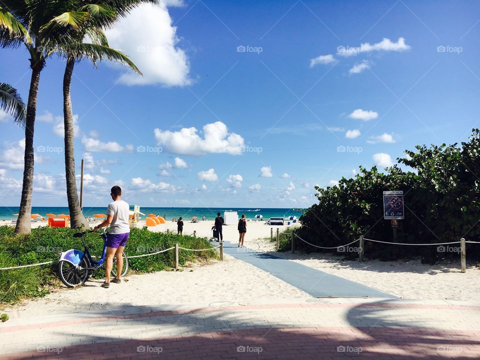 Lovely beach day in Miami. Hot. Culture in the air. Friendly people. Sand. Tan. Enlivening