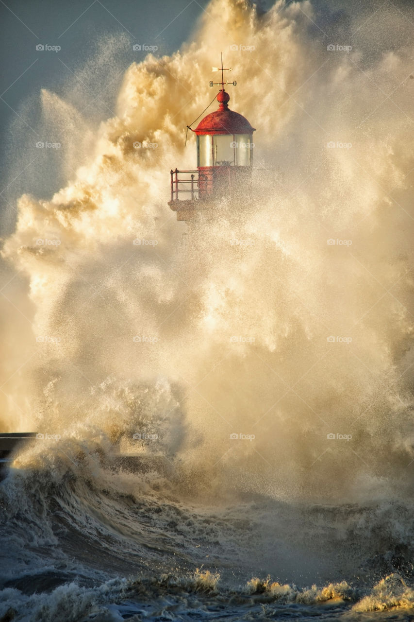 Waves crashing on lighthouse