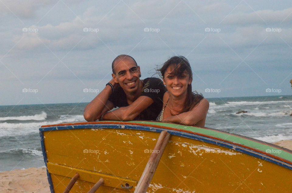Couple behind boat 