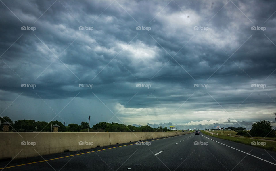 Stormy clouds over highway