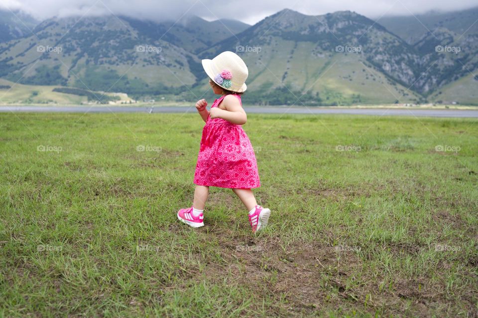 running in the grass in summer