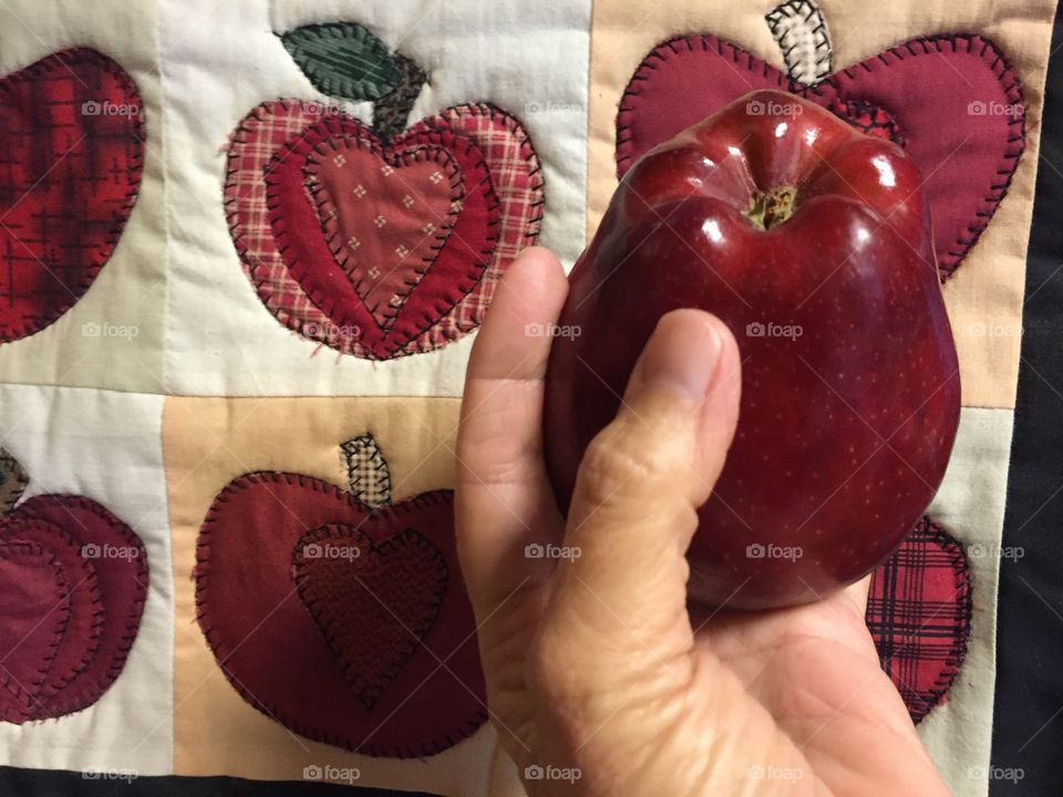 Holding an apple