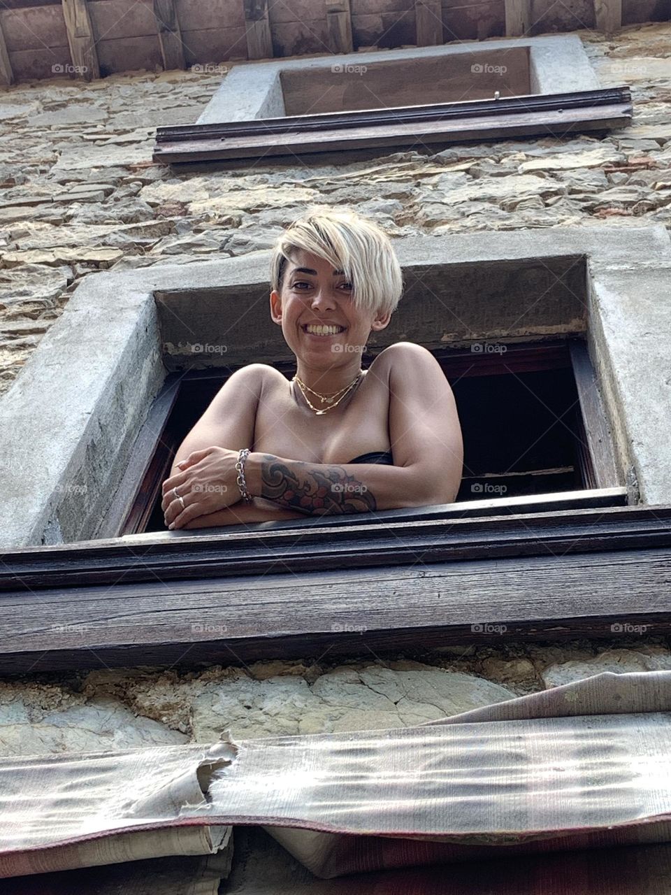 Woman smiling at window 