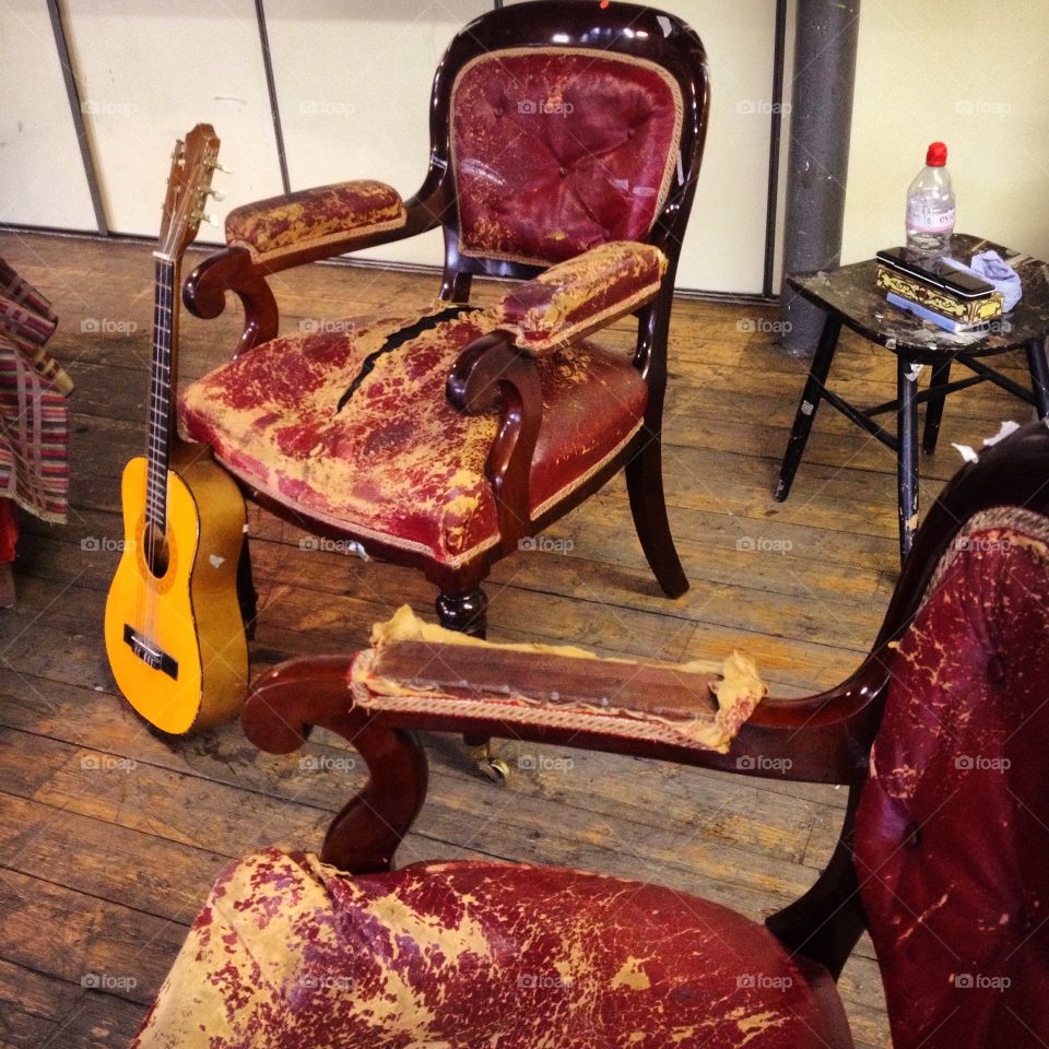 Room with Guitar . Empty room with two chairs and one guitar 