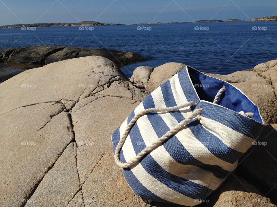 Bag on rocks at sea