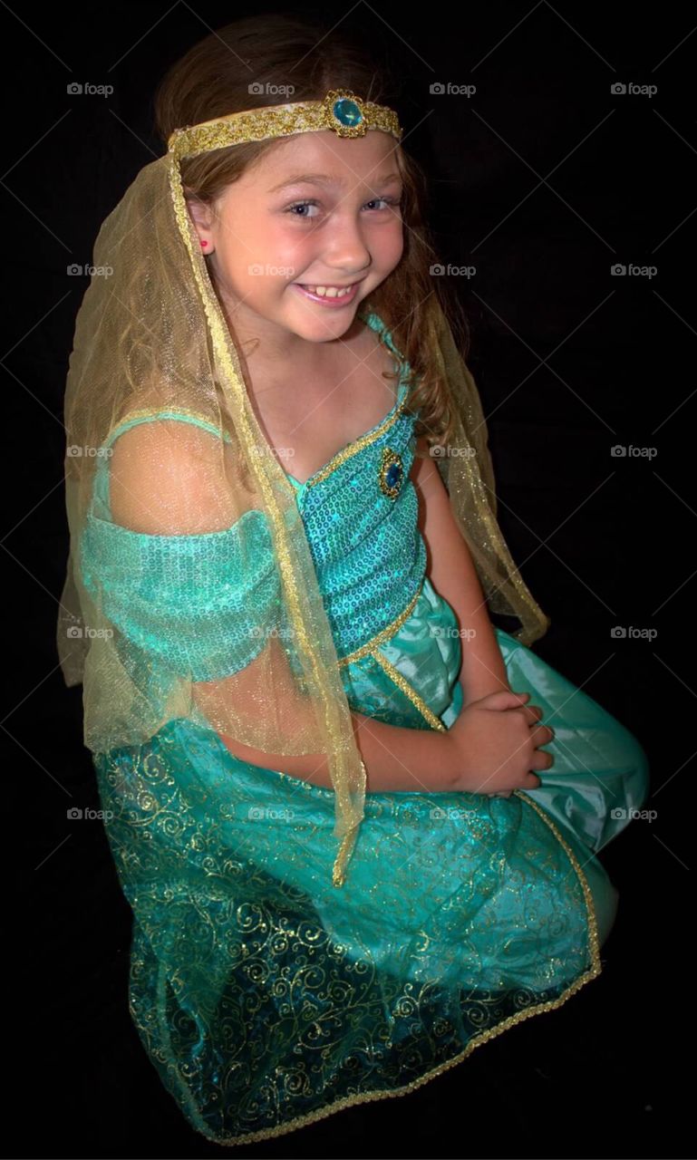 Smiling girl on black background