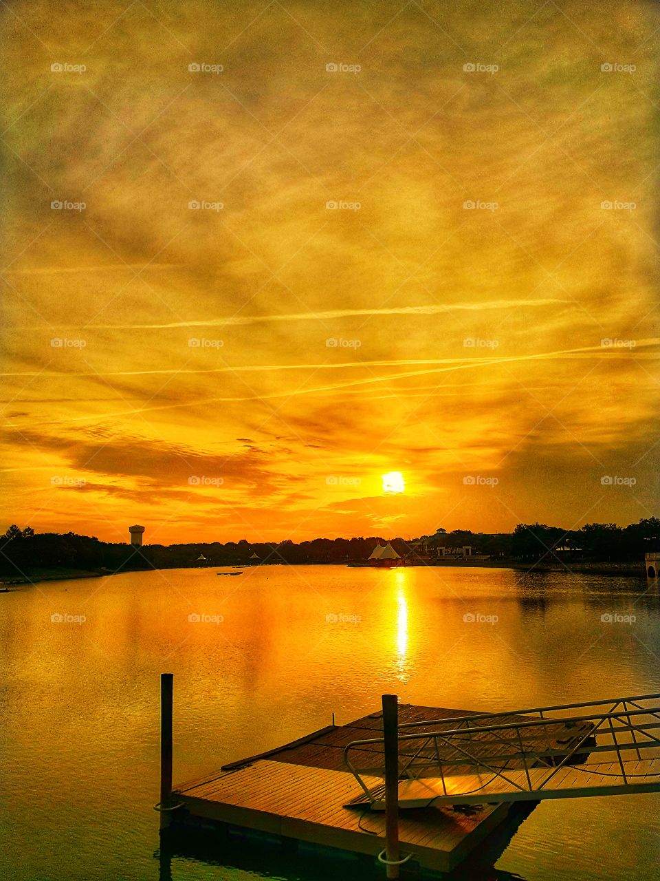 Landscape photo of a golden sunrise at Cranes Roost Park in Altamonte Springs, Florida.