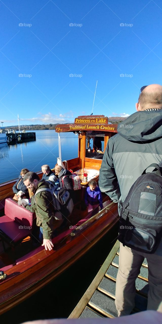 boarding a small tourist boat on lake