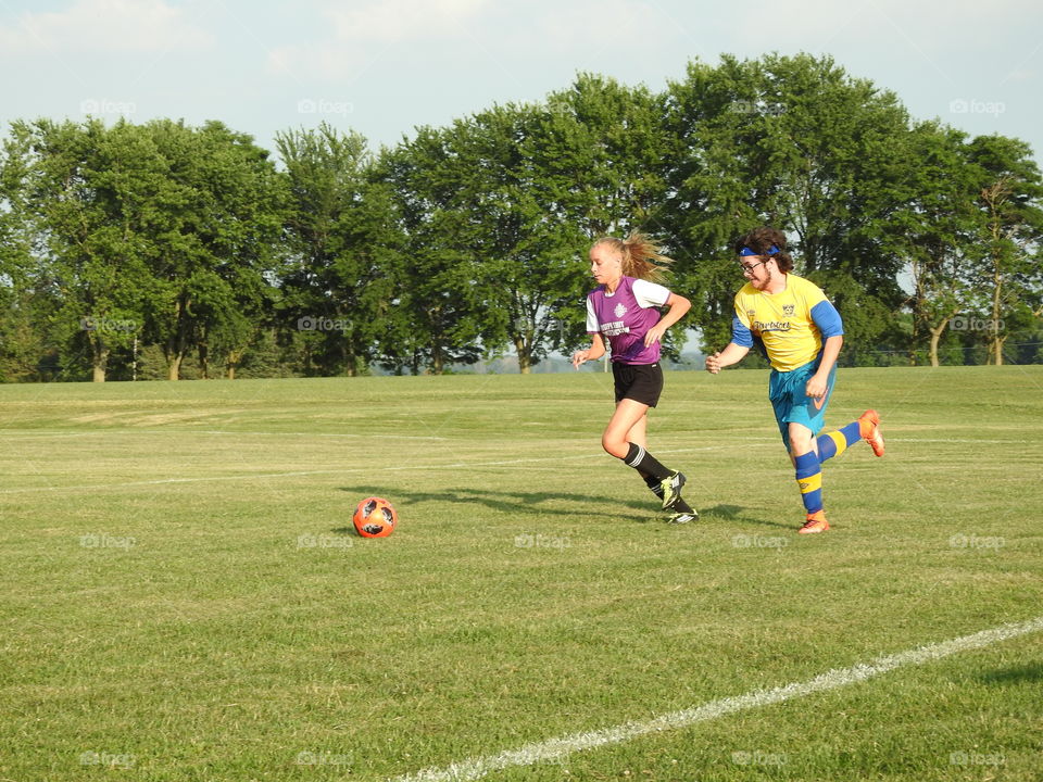 running for the soccer ball