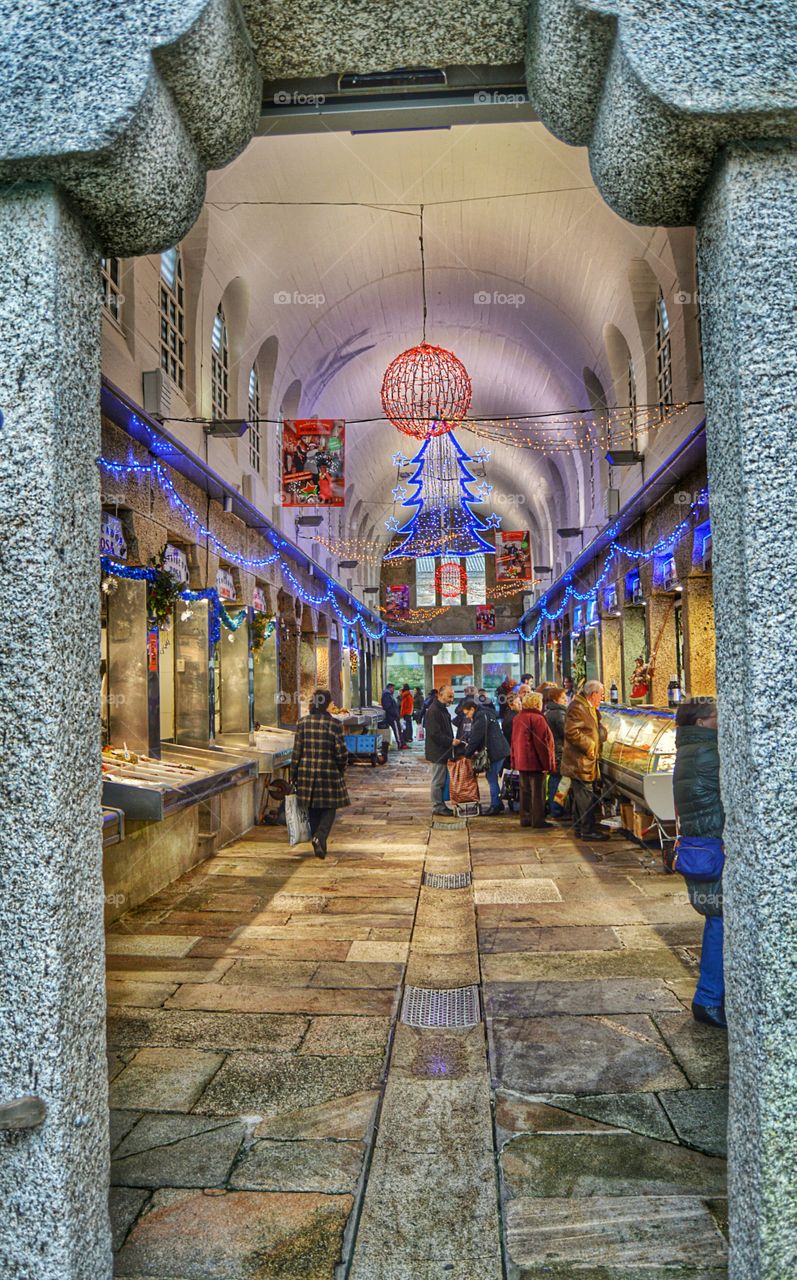 Christmas shopping. Shopping for food at Christmas in Plaza de Abastos, Santiago de Compostela.