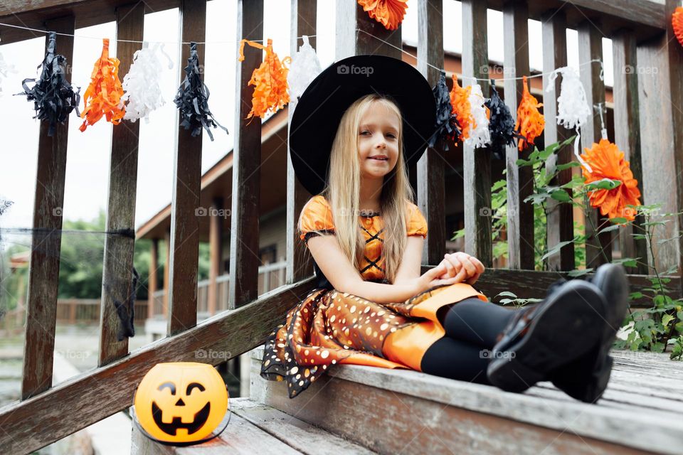 Kid celebrating Halloween outdoor 