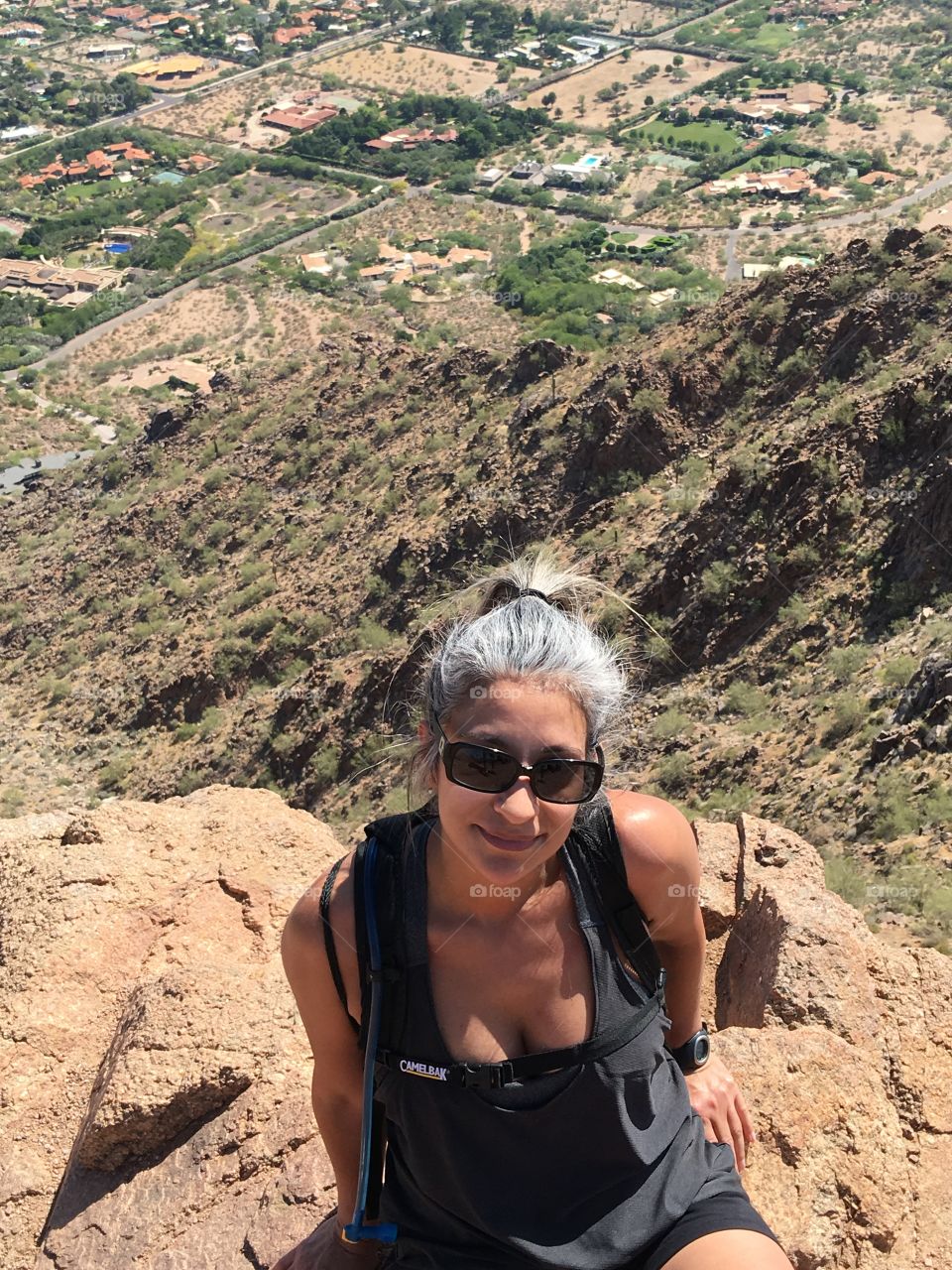 Woman on top of mountain 