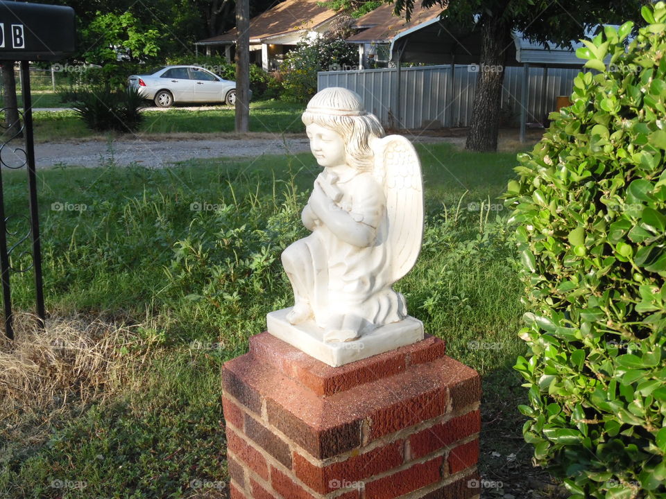 praying π angel π. This is a picture of a little statue that I saw while out walking πΆ π π₯ π¨ this morning near Graham Texas
