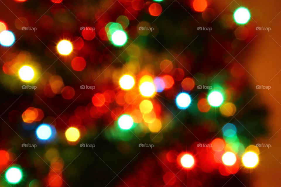 Macro shot of Christmas tree decorations and vivid lights